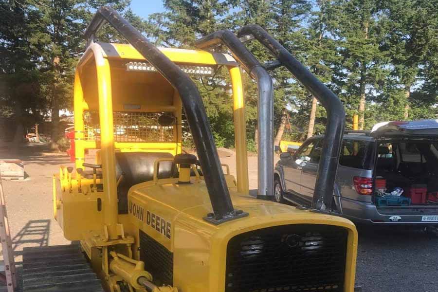 bent steel parts for additional cab caging and exhaust systems on dozers